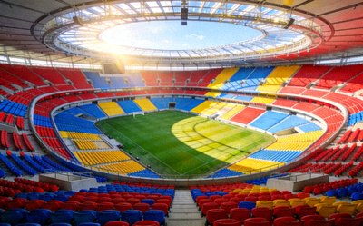 崭新的现代化足球体育场内部全景，座椅颜色鲜艳